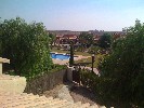 <strong>View from the roof terrace across one of the community pools</strong> <br /><em> Hacienda del Alamo community, taken on 01 October 2011 by Emunmoo</em>