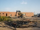 <strong>Digger clears surface</strong> <br /><em> Hacienda San Cayetano community, taken on 29 April 2010 by downside</em>