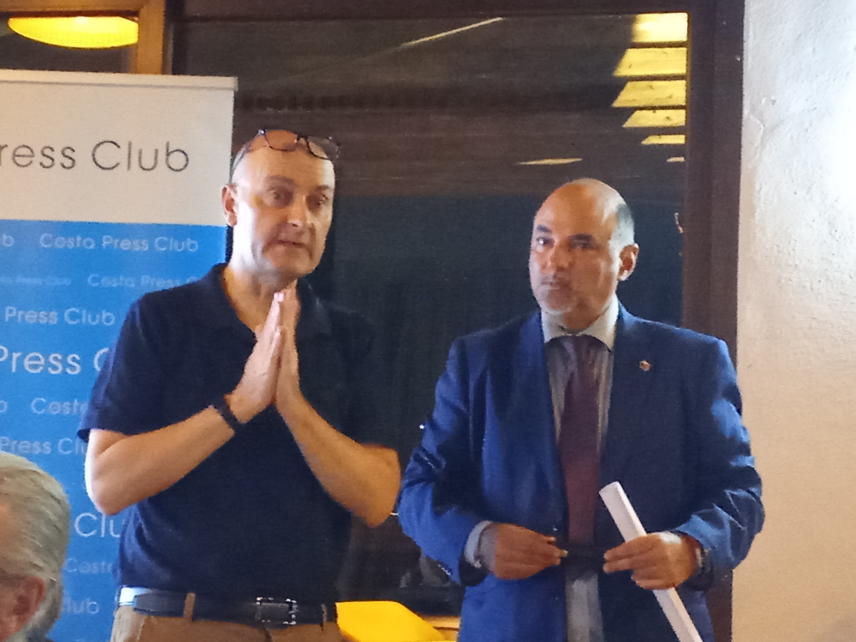 People struggle against the wind and rain in Malmö, Sweden, after a storm reached southern Sweden, Saturday Oct. 4, 2025. (Johan Nilsson/TT via AP)