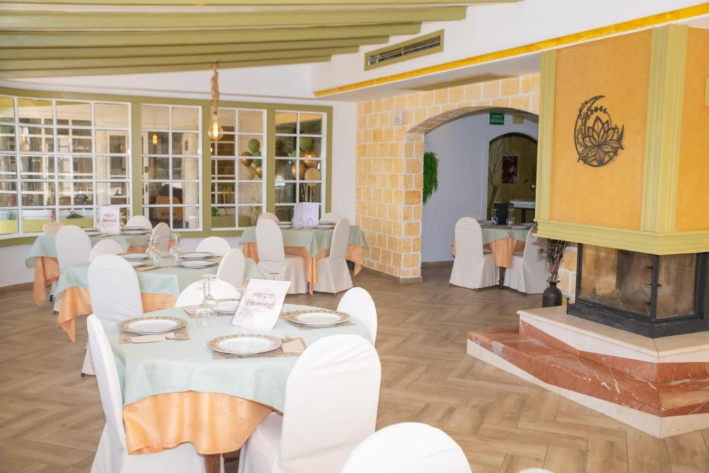 A puréed and simmering carrot soup in a pot with a spoon