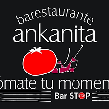 A puréed and simmering carrot soup in a pot with a spoon