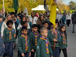 People struggle against the wind and rain in Malmö, Sweden, after a storm reached southern Sweden, Saturday Oct. 4, 2025. (Johan Nilsson/TT via AP)