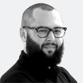 People struggle against the wind and rain in Malmö, Sweden, after a storm reached southern Sweden, Saturday Oct. 4, 2025. (Johan Nilsson/TT via AP)