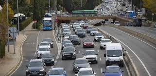 People struggle against the wind and rain in Malmö, Sweden, after a storm reached southern Sweden, Saturday Oct. 4, 2025. (Johan Nilsson/TT via AP)