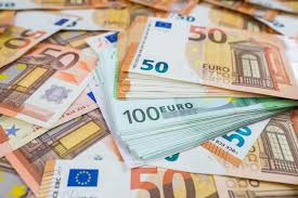 People struggle against the wind and rain in Malmö, Sweden, after a storm reached southern Sweden, Saturday Oct. 4, 2025. (Johan Nilsson/TT via AP)