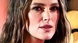 People struggle against the wind and rain in Malmö, Sweden, after a storm reached southern Sweden, Saturday Oct. 4, 2025. (Johan Nilsson/TT via AP)