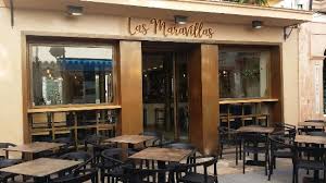 People struggle against the wind and rain in Malmö, Sweden, after a storm reached southern Sweden, Saturday Oct. 4, 2025. (Johan Nilsson/TT via AP)