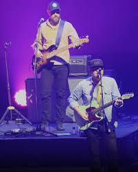 People struggle against the wind and rain in Malmö, Sweden, after a storm reached southern Sweden, Saturday Oct. 4, 2025. (Johan Nilsson/TT via AP)