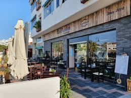 People struggle against the wind and rain in Malmö, Sweden, after a storm reached southern Sweden, Saturday Oct. 4, 2025. (Johan Nilsson/TT via AP)