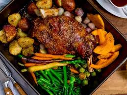 People struggle against the wind and rain in Malmö, Sweden, after a storm reached southern Sweden, Saturday Oct. 4, 2025. (Johan Nilsson/TT via AP)
