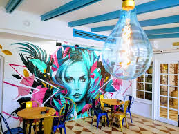 People struggle against the wind and rain in Malmö, Sweden, after a storm reached southern Sweden, Saturday Oct. 4, 2025. (Johan Nilsson/TT via AP)