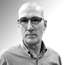 People struggle against the wind and rain in Malmö, Sweden, after a storm reached southern Sweden, Saturday Oct. 4, 2025. (Johan Nilsson/TT via AP)