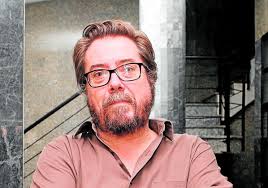 People struggle against the wind and rain in Malmö, Sweden, after a storm reached southern Sweden, Saturday Oct. 4, 2025. (Johan Nilsson/TT via AP)