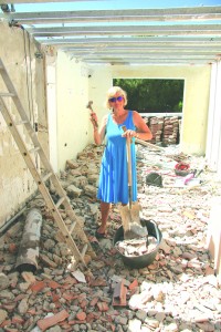 Terttu Balson among the rubble which was her home